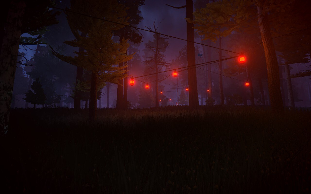 Red lanterns strung among trees.